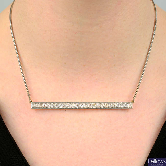 An old-cut diamond bar necklace, on 18ct gold snake-link chain.