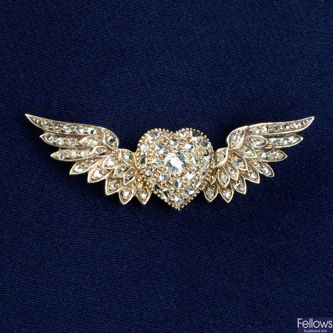 A late Victorian silver and gold, old and rose-cut diamond winged heart brooch.
