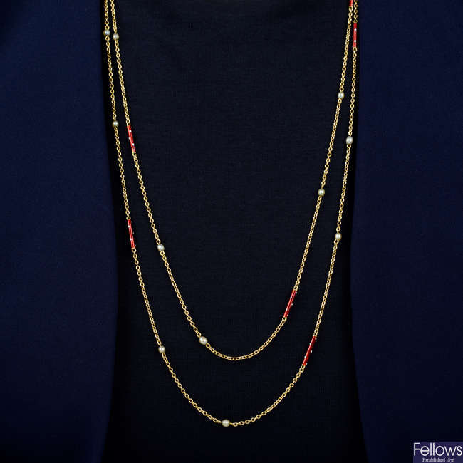An early 20th century 15ct gold longuard chain necklace, with seed pearl and enamel spacers.