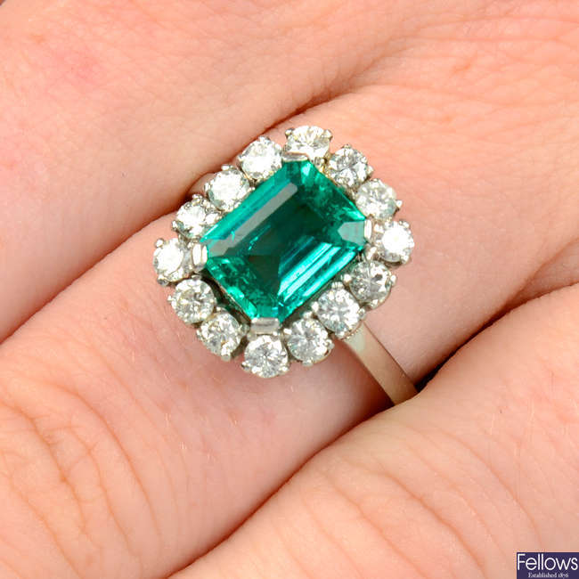 A Colombian emerald and brilliant-cut diamond cluster ring, engraved Scortecci.