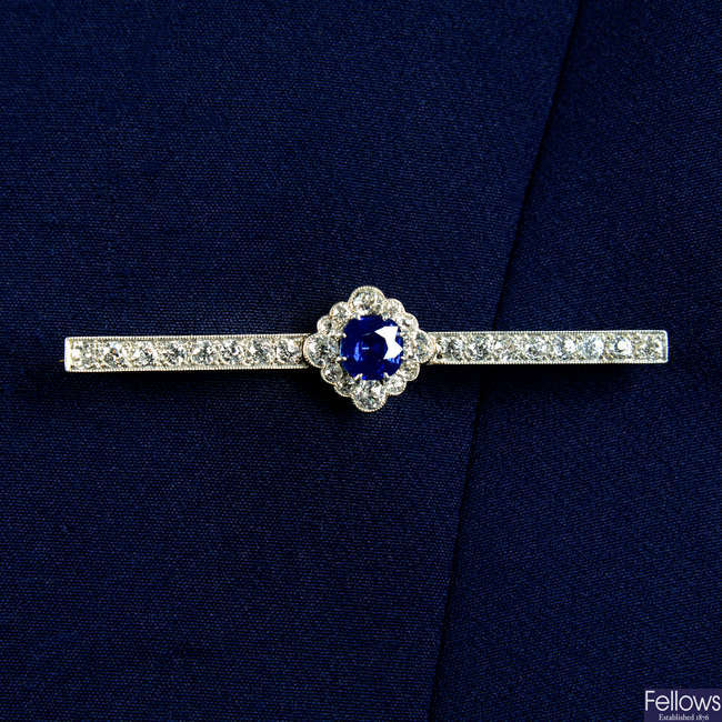 An early 20th century platinum and gold, sapphire and diamond bar brooch.