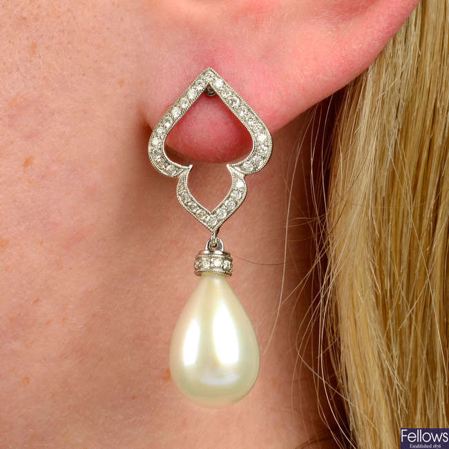A pair of 18ct gold brilliant-cut diamond stylised foliate earrings, with cultured pearl drop.