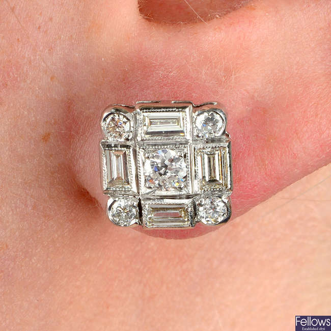 A pair of vari-cut diamond cluster earrings.