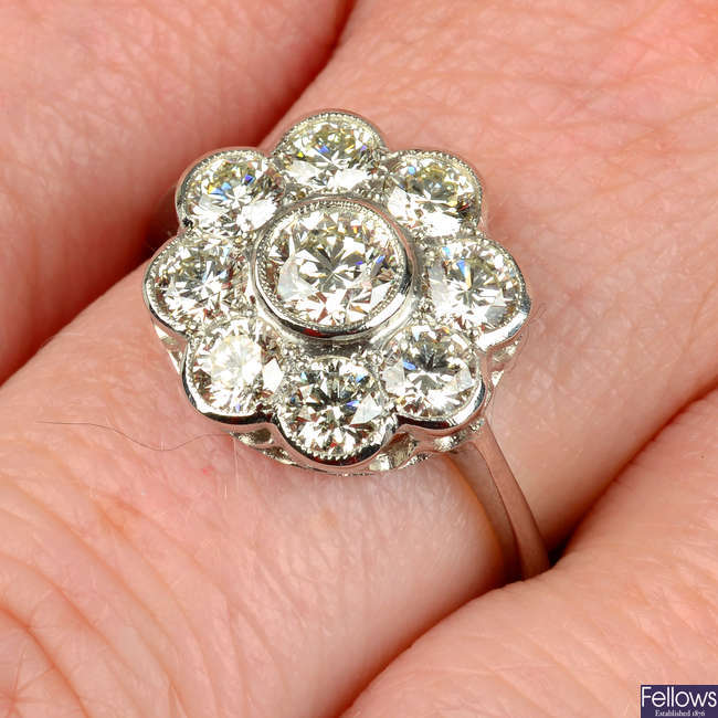 A brilliant-cut diamond floral cluster ring.