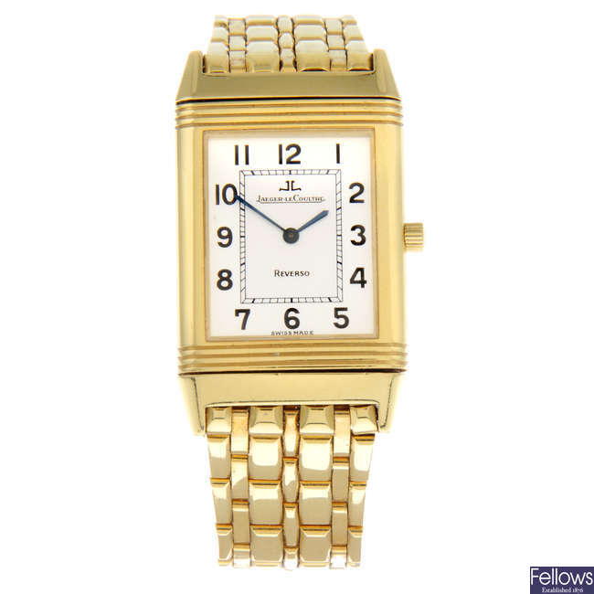JAEGER-LECOULTRE - an 18ct yellow gold Reverso bracelet watch, 22mm.
