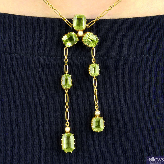 An early 20th century 15ct gold peridot and split pearl negligee pendant. 