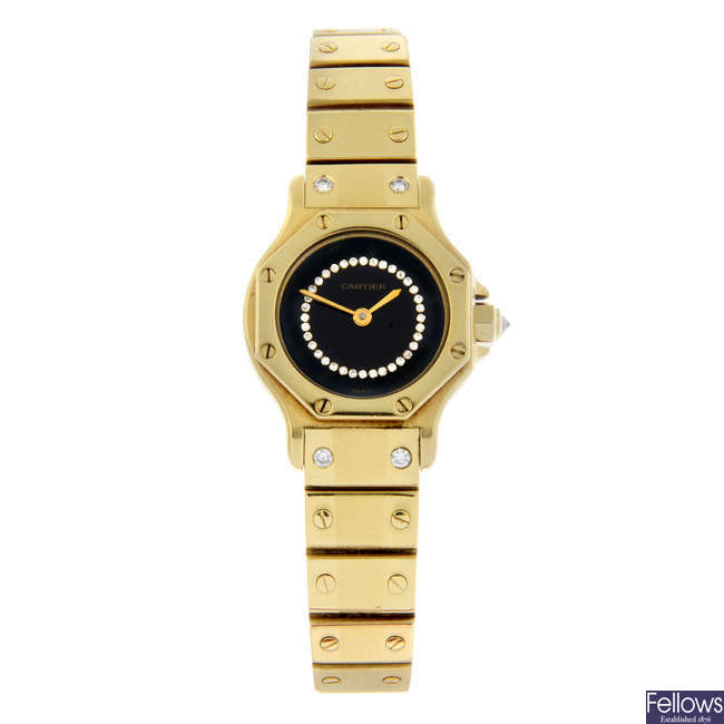 CARTIER - an 18ct yellow gold Santos Octagon bracelet watch, 24mm.