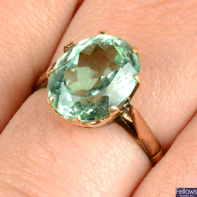 A bluish green tourmaline single-stone ring.