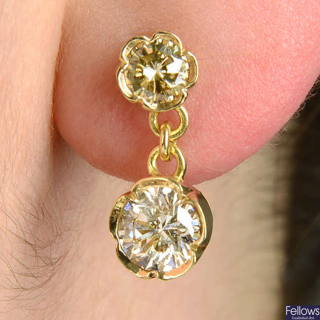 A pair of 'yellow' and 'brown' brilliant-cut diamond drop earrings.