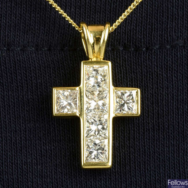 An 18ct gold square-shape diamond crucifix pendant, by Theo Fennell.