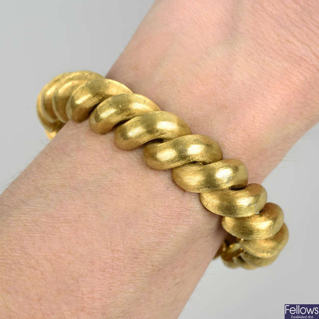A 1960s textured 18ct gold bracelet, retailed by Kutchinsky.