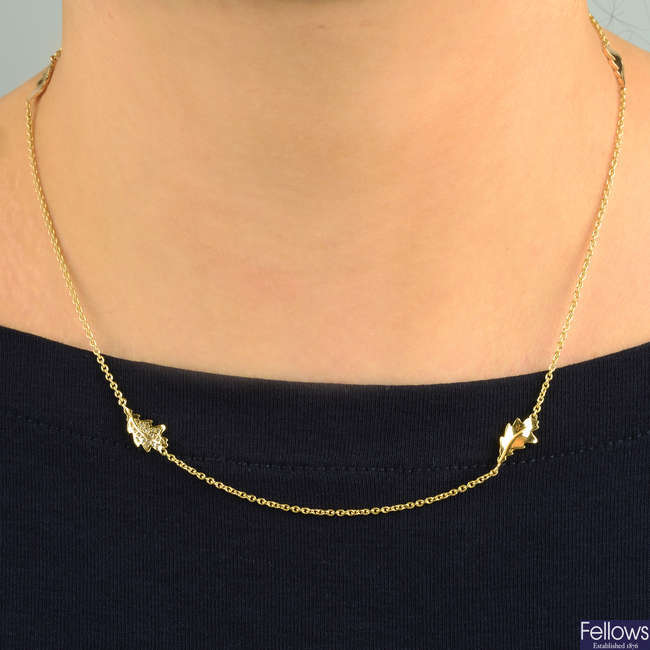 A tri-colour 18ct gold foliate motif necklace, with pavé-set diamond highlight, by Asprey.