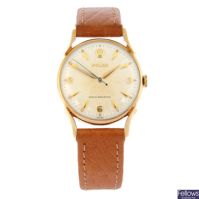 ROLEX - a 9ct yellow gold wrist watch, 32mm.
