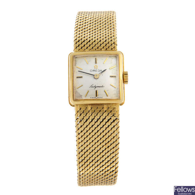 OMEGA - an 18ct yellow gold Ladymatic bracelet watch, 19mm.