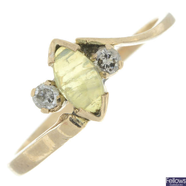 Yellow gem & diamond three-stone ring