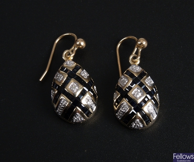 A pair of sapphire and diamond lattice style egg