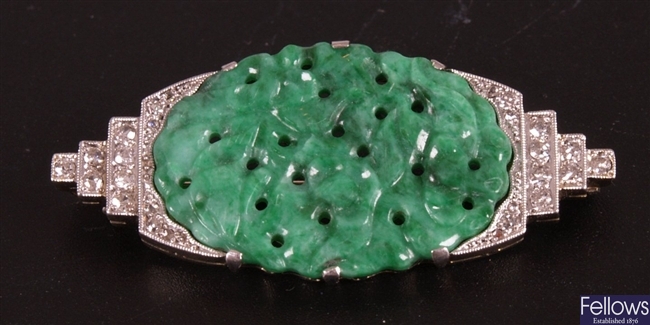 Platinum diamond and jade set brooch, a central 