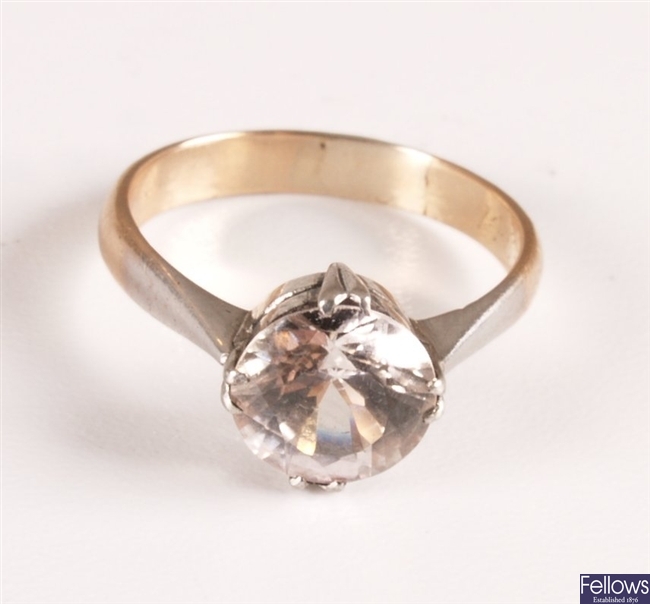 A single stone white sapphire claw set dress ring