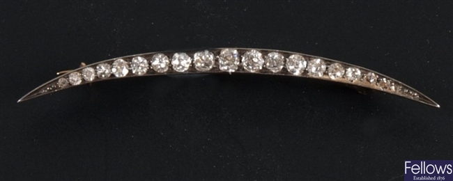Diamond cresent brooch,  set with nineteen