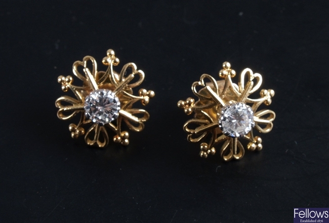 Pair of diamond stud earrings of some 0.55ct each