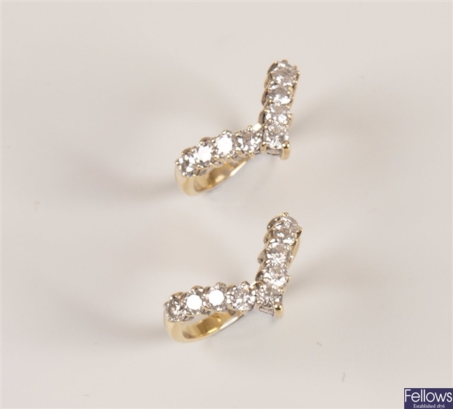A pair of 18ct gold nine stone diamond wishbone