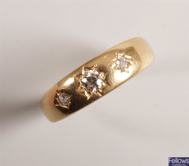18ct gold three stone diamond gypsy ring.