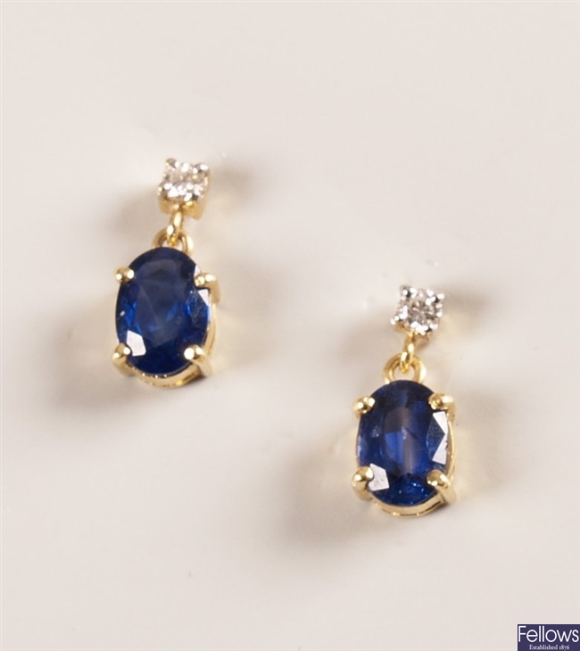 A pair of 18ct gold diamond stud earrings with an