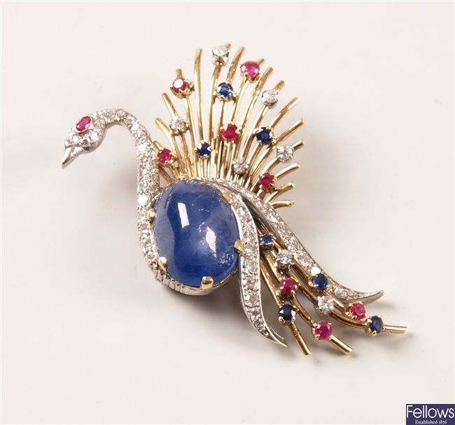 A multi gem set peacock brooch with a star