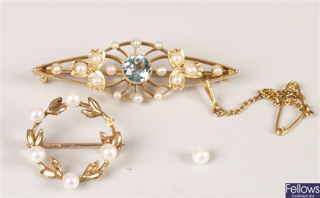 Two brooches to include a 15ct gold aquamarine