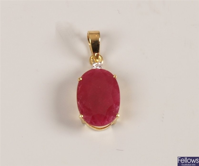 18ct gold ruby and diamond pendant with a round