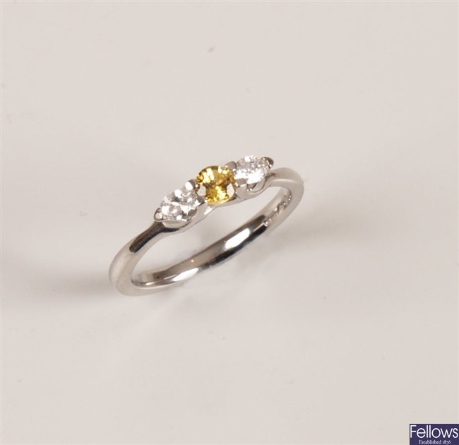 Platinum three stone yellow sapphire and diamond