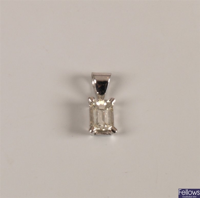 A single stone diamond pendant set an emerald cut