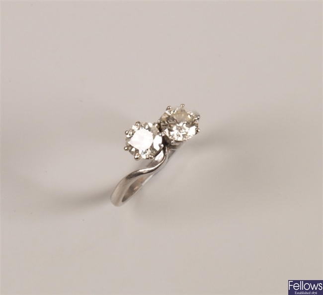Platinum two stone diamond crossover design ring