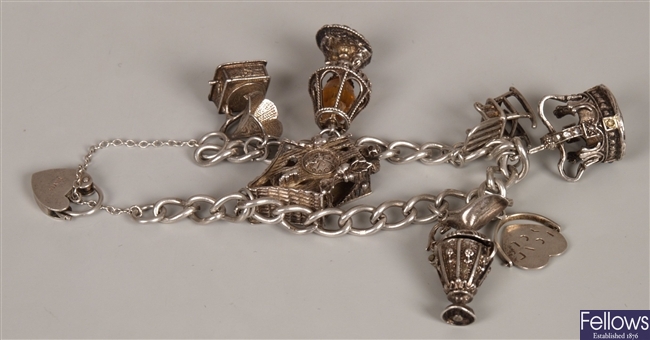 Silver curb link charm bracelet with seven