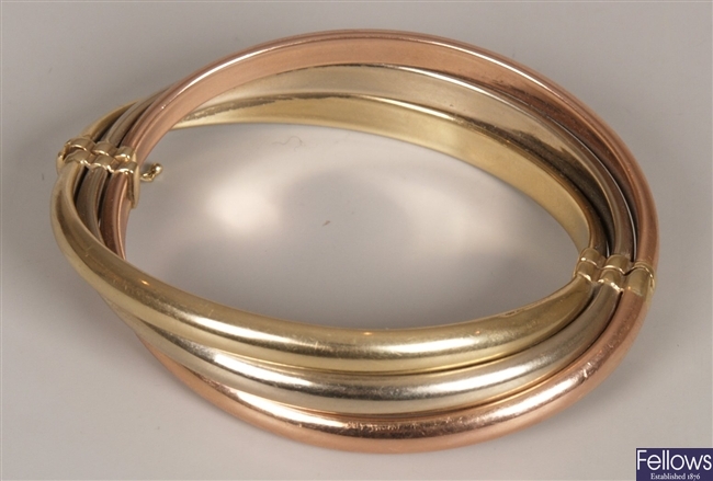 9ct tri-colour gold hollow crossover bangle. 