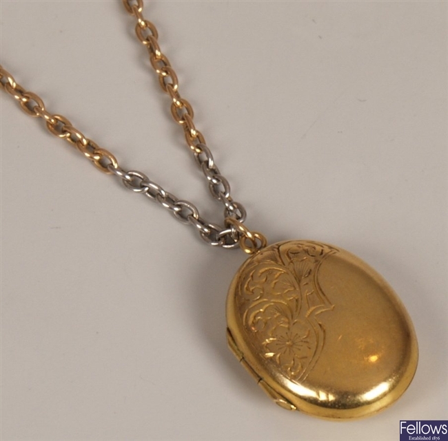 9ct B&F oval locket with floral motif suspended