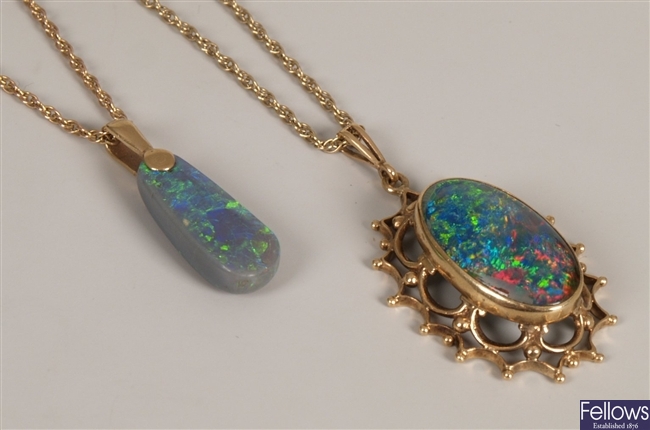 Two pendants to include an oval opal pendant in a