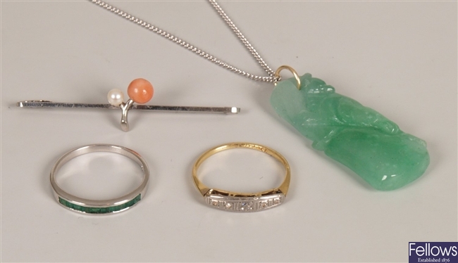 Four items of jewellery to include a carved jade