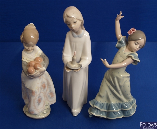 Three various Lladro figurines.