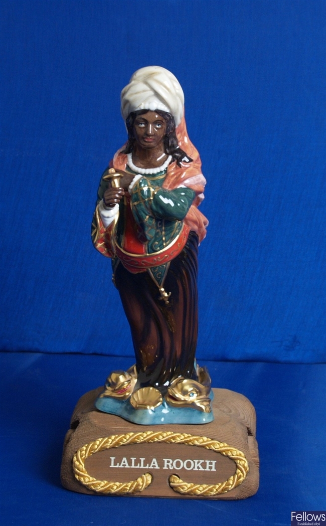 A Royal Doulton bone china figurine modeled as