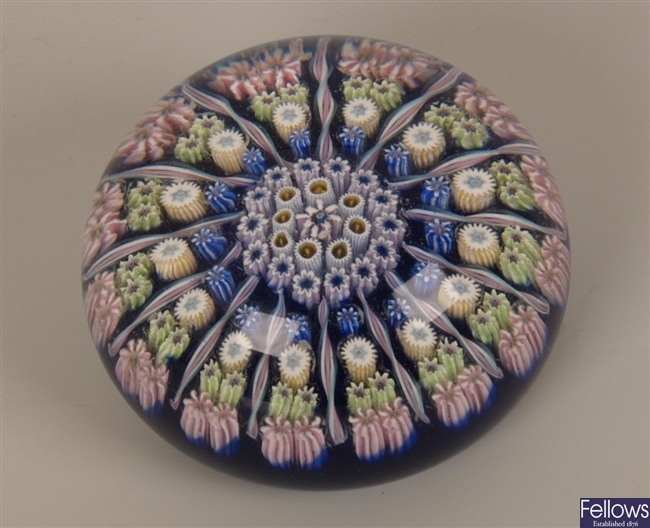 A millefiori glass paperweight with twisted multi
