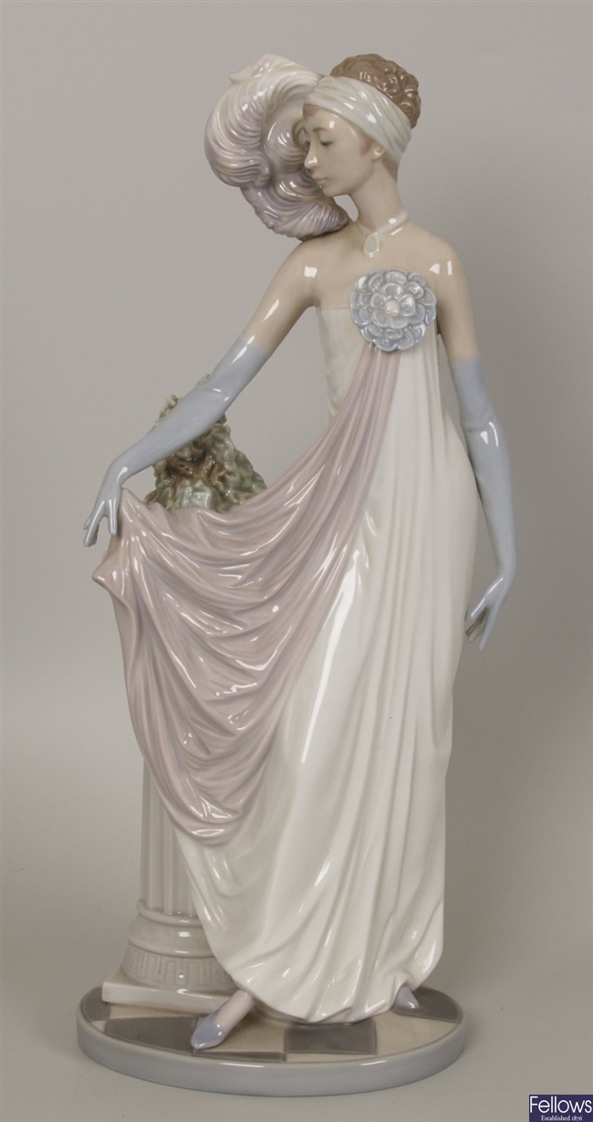 A Lladro figure of an elegant 1920's lady,