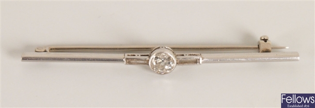 Three stone diamond bar brooch with a principle
