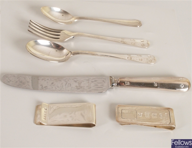 Four items of silver, to include two money clips,