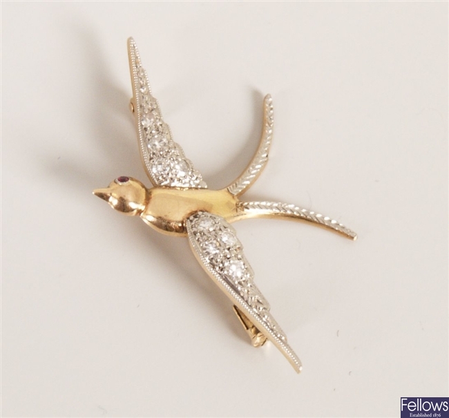 Diamond swallow brooch with pave set eight cut