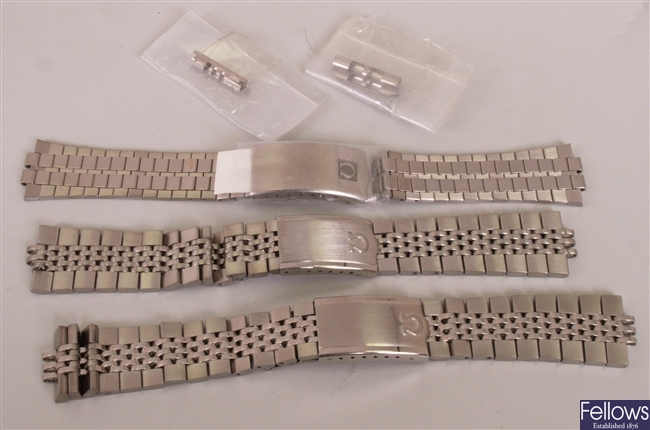 OMEGA - three assorted steel link bracelets of