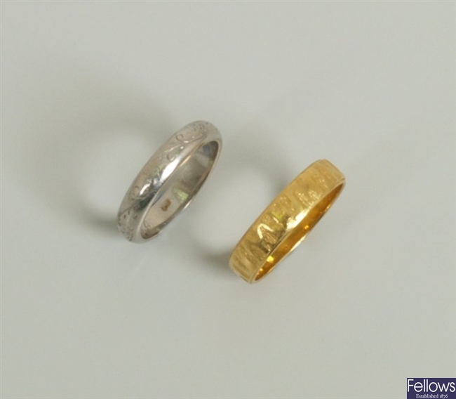 Two rings to include a platinum band ring with
