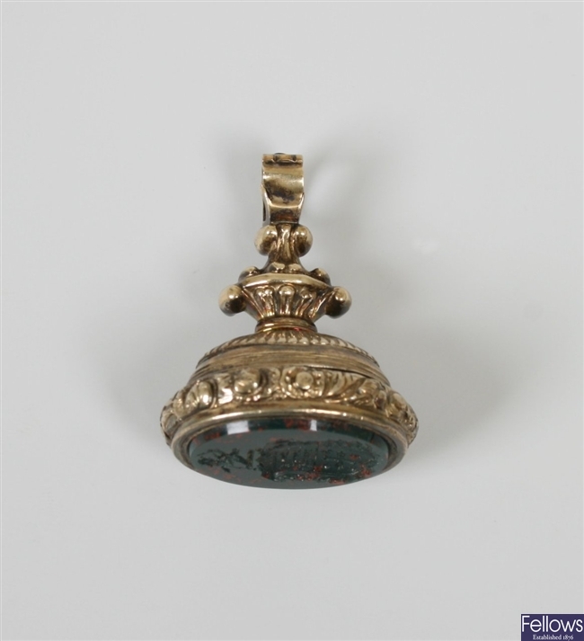 Ornate bloodstone set fob with a scroll design