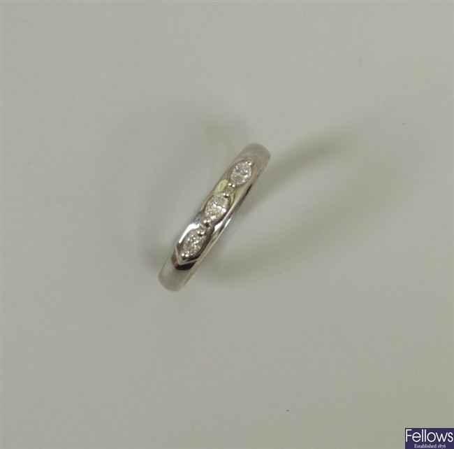 Platinum mounted three stone diamond band ring,