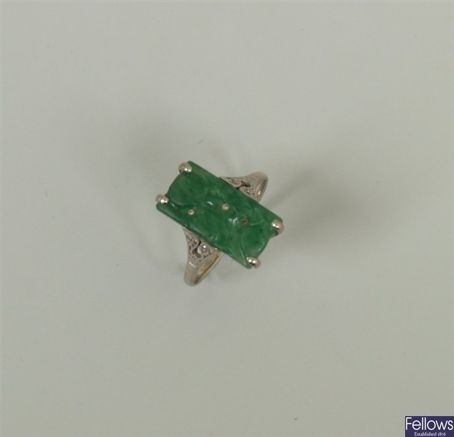 A jade and diamond ring, with a central